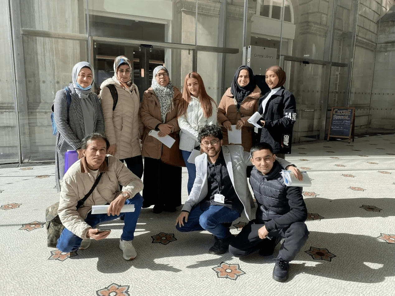 Sahil Sayed with ESOL students outside Manchester Central Library