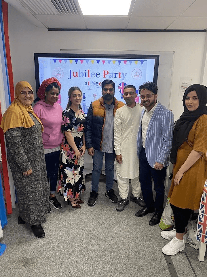 Sahil Sayed with ESOL students at a Jubilee Party celebration in Manchester
