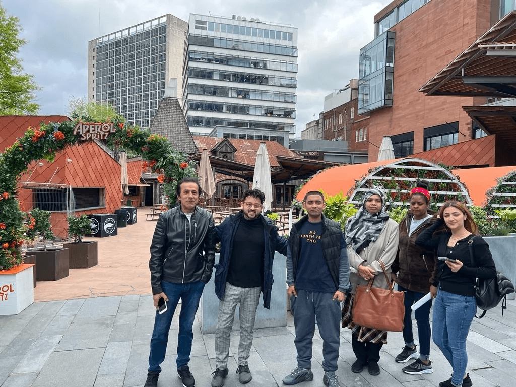 Sahil Sayed with a group of English language students